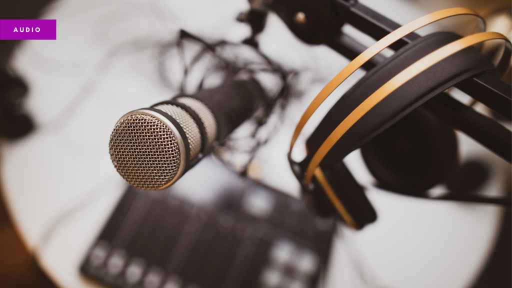 Photo of a microphone, headphones and recording equipment