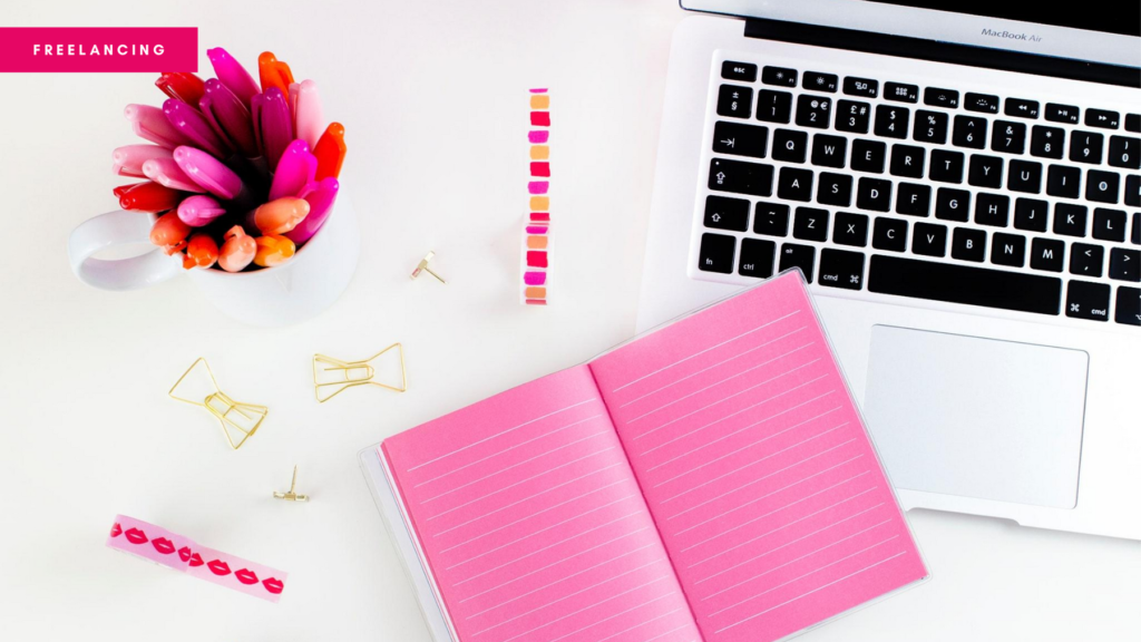 Blog header photo showing a desk with notepad, laptop, pens etc. on it